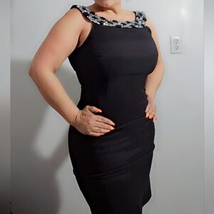 Elegant Black Sleeveless Dress with Embellished Neckline